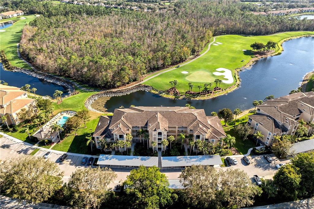 3800 Sawgrass Way, Unit 3142 Naples, FL 34112 - Photo 42 of 50 an aerial view of a house with a yard and potted plants