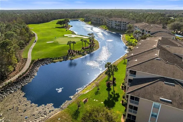an aerial view of a house with a swimming pool
