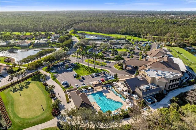 an aerial view of a house with a swimming pool