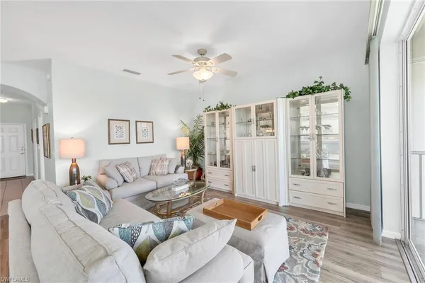 a living room with furniture and a window