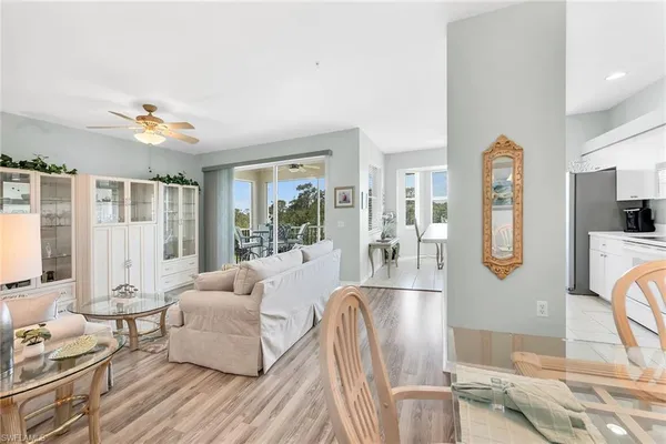a living room with furniture fireplace and flat screen tv