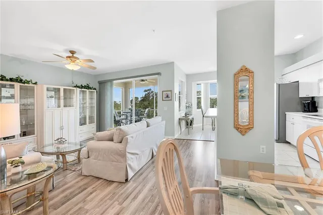 a living room with furniture fireplace and flat screen tv