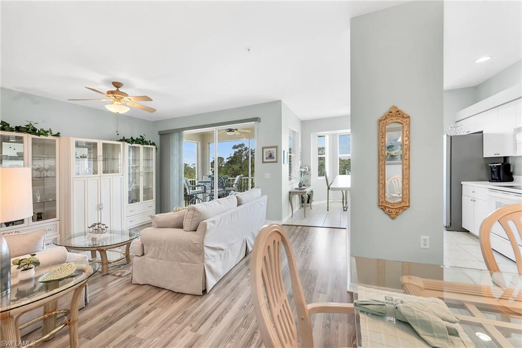 3800 Sawgrass Way, Unit 3142 Naples, FL 34112 - Photo 9 of 50 a living room with furniture fireplace and flat screen tv