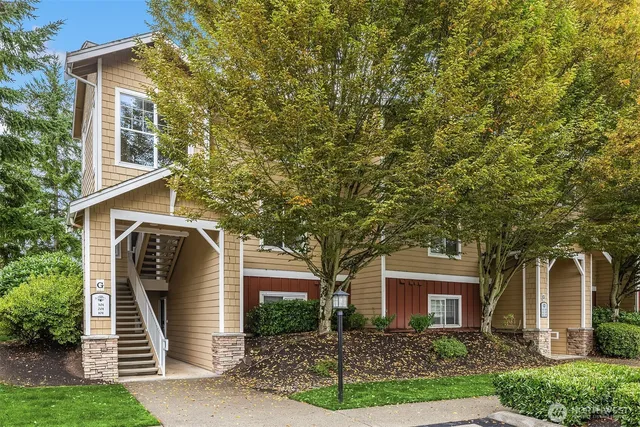 front view of a house with an trees