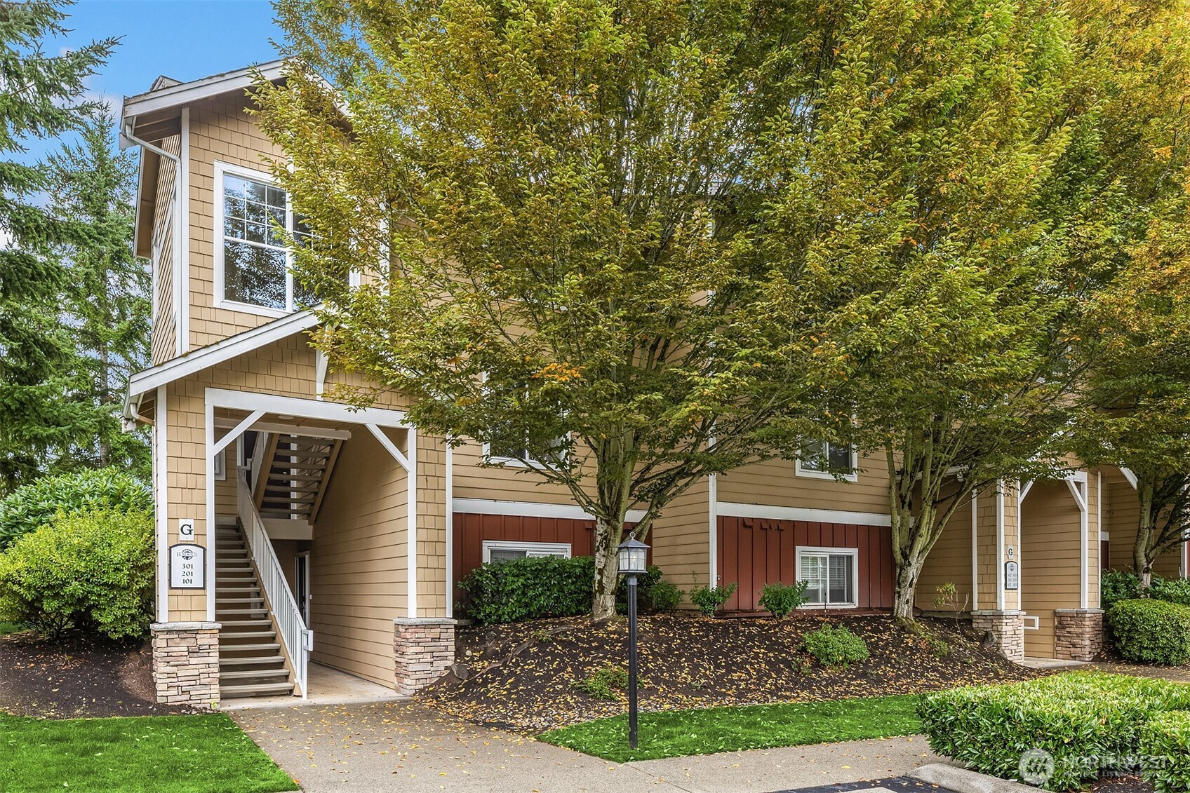 front view of a house with an trees