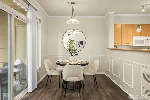 a view of a dining room with furniture window and wooden floor