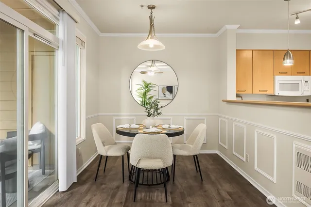 a view of a dining room with furniture window and wooden floor