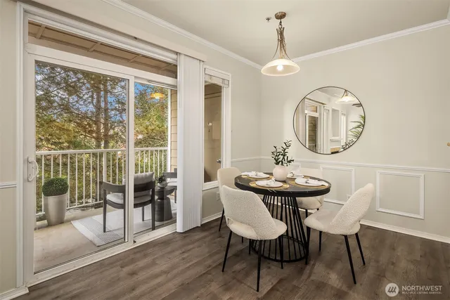 a view of a dining room with furniture window and wooden floor