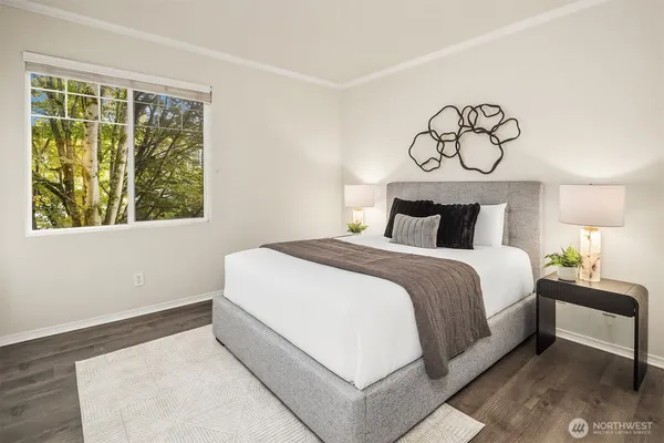 a bedroom with a bed and window