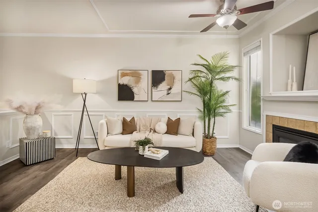 a living room with furniture a chandelier and a fireplace
