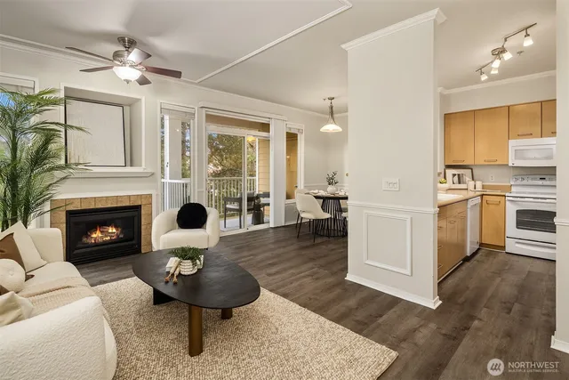 a living room with furniture a fireplace and a chandelier