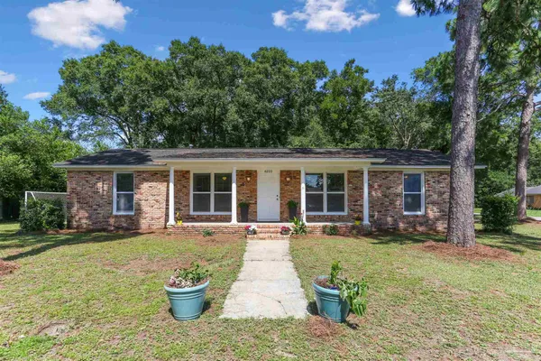 front view of a house with a yard