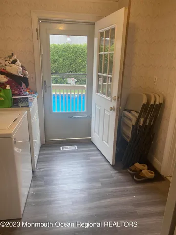 a dining room with furniture and chandelier