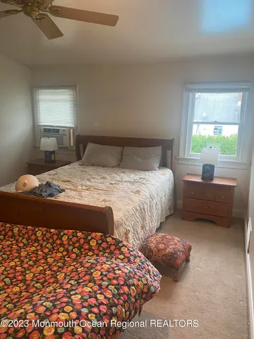 a bedroom with double bed and a window