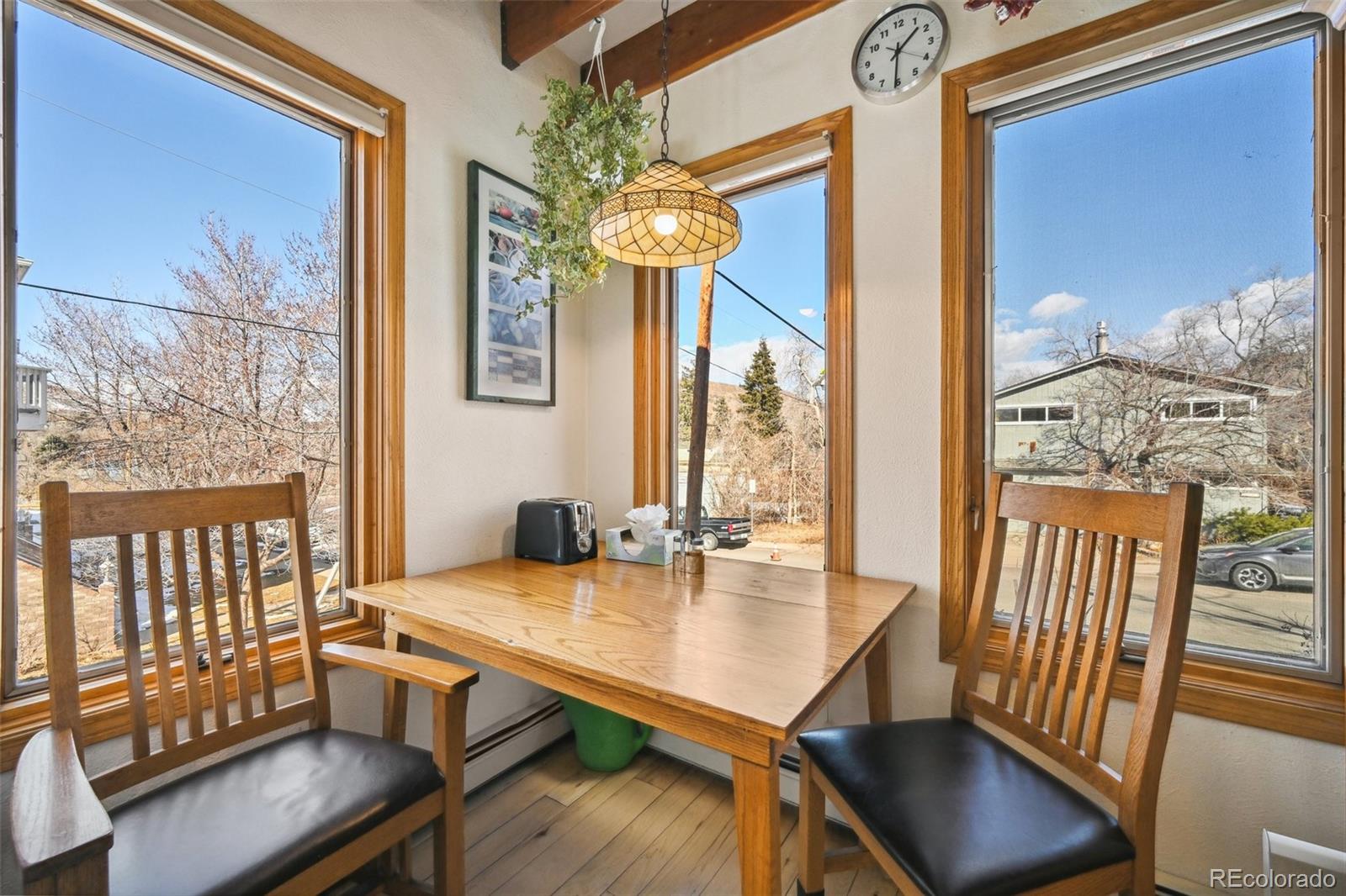 1112 Maple Street Golden, CO 80401 - Photo 11 of 36 a room with furniture and wooden floor