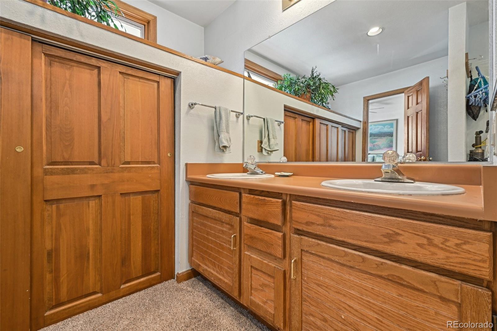 1112 Maple Street Golden, CO 80401 - Photo 15 of 36 a bathroom with a sink and a mirror