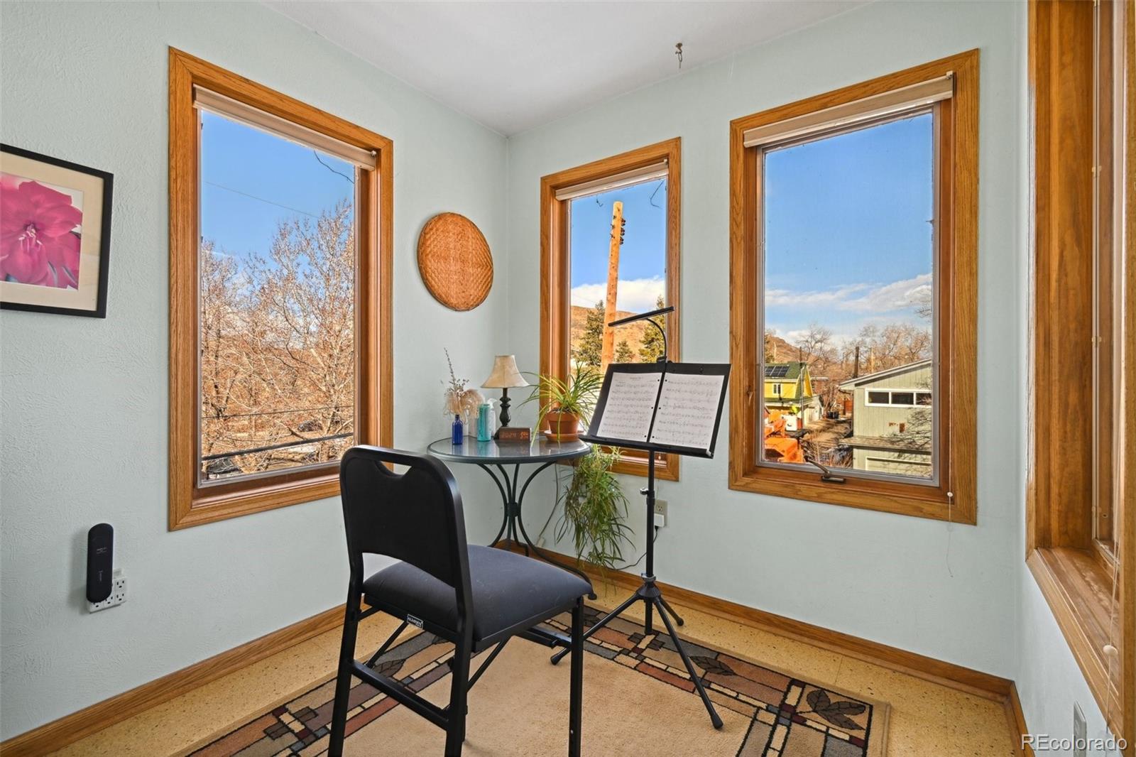 1112 Maple Street Golden, CO 80401 - Photo 16 of 36 a view of a workspace room with furniture and a window