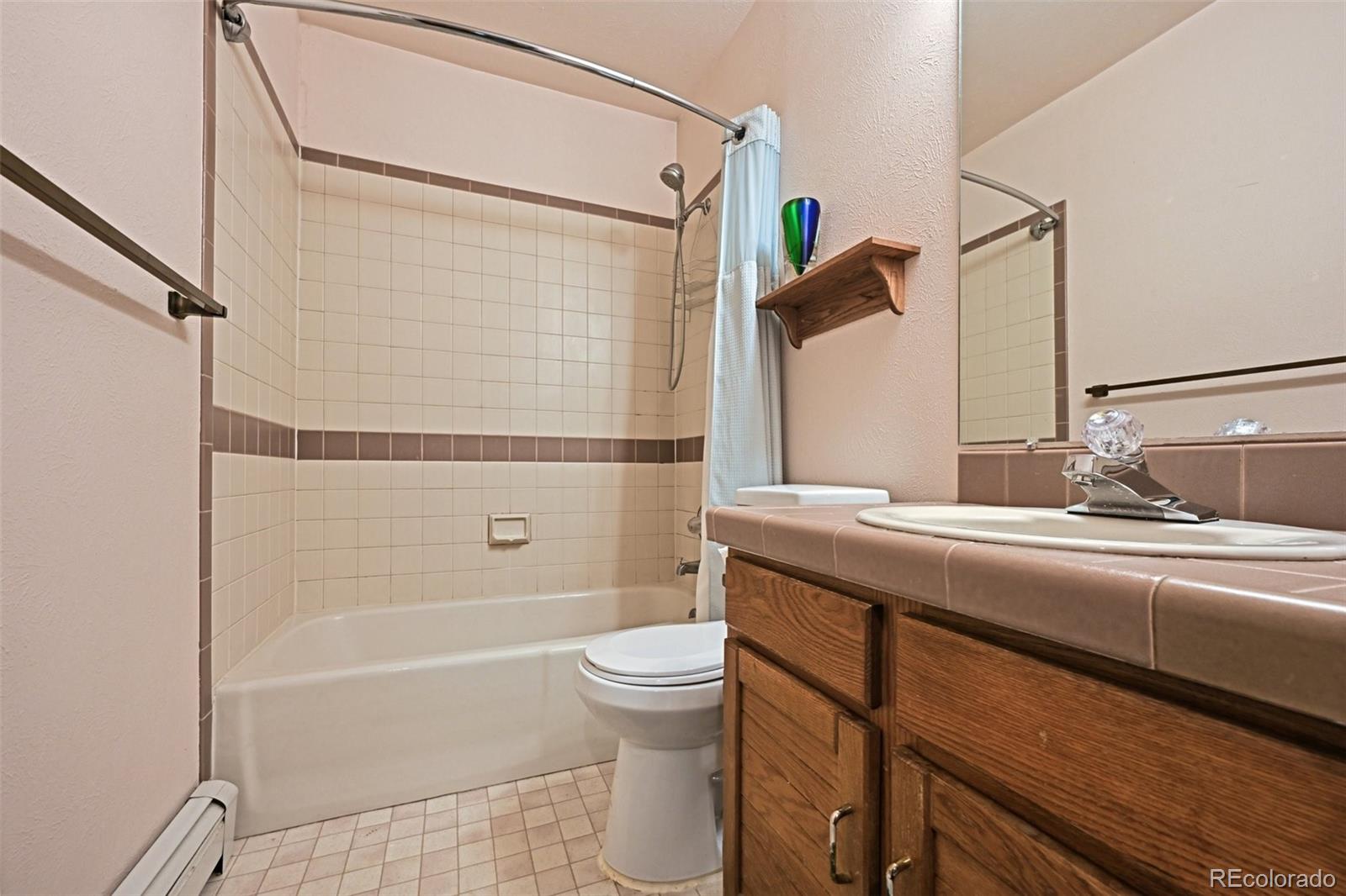1112 Maple Street Golden, CO 80401 - Photo 20 of 36 a bathroom with a sink a toilet and shower