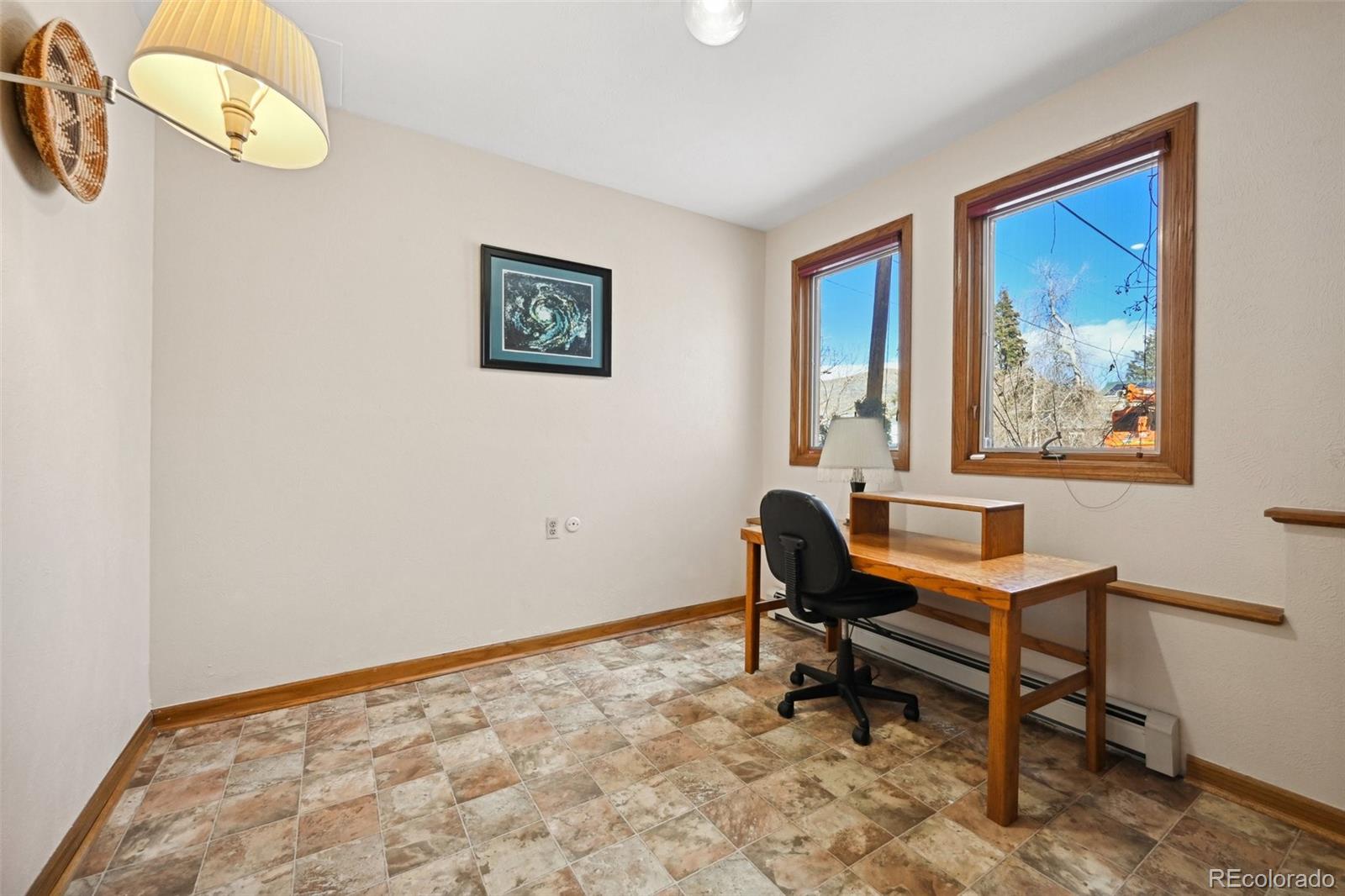 1112 Maple Street Golden, CO 80401 - Photo 21 of 36 a view of a workspace with furniture and a window