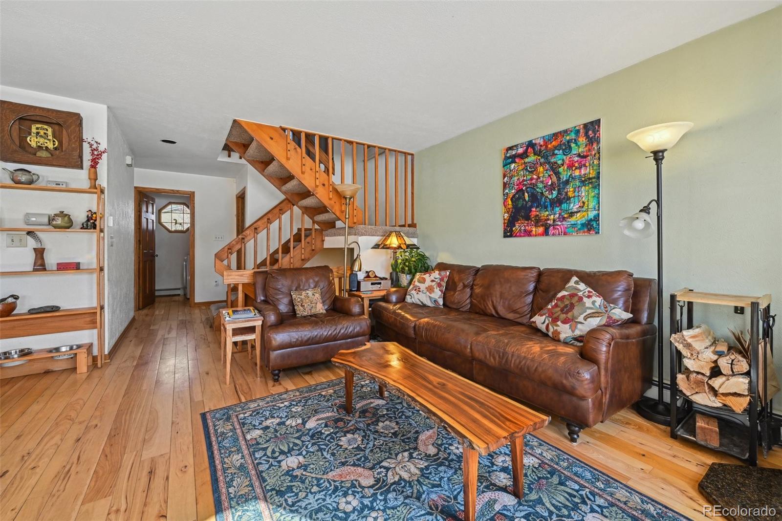 1112 Maple Street Golden, CO 80401 - Photo 6 of 36 a living room with furniture and a wooden floor