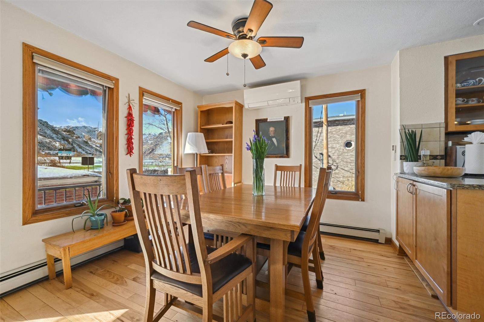 1112 Maple Street Golden, CO 80401 - Photo 8 of 36 a view of a dining room with furniture window and wooden floor