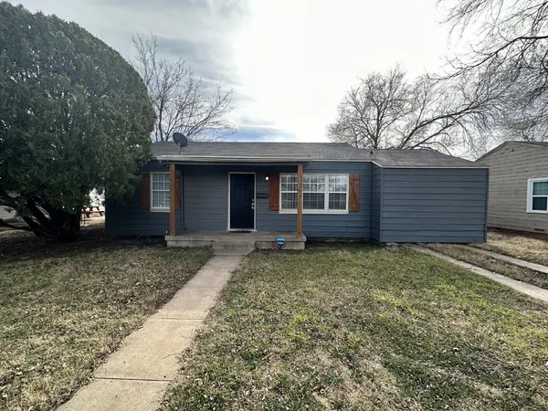 a house with trees in front of it