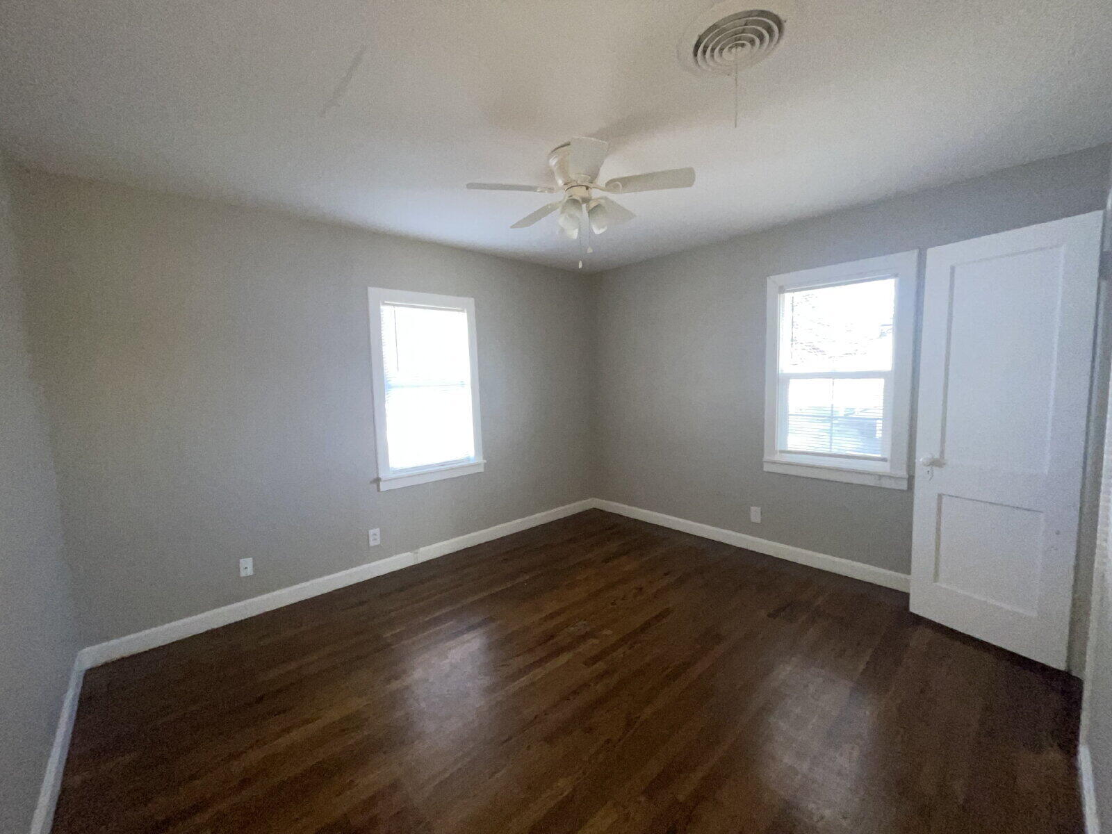 2513 29th Street Lubbock, TX 79410 - Photo 12 of 15 a view of an empty room with wooden floor and a window