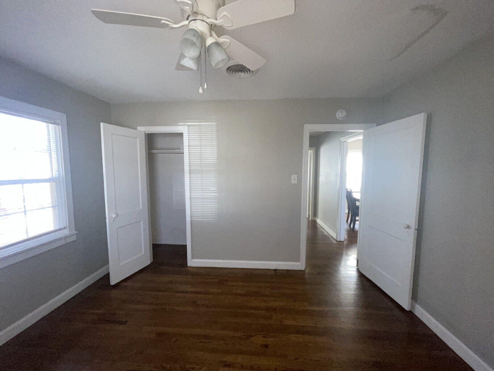 2513 29th Street Lubbock, TX 79410 - Photo 9 of 15 an empty room with wooden floor and windows