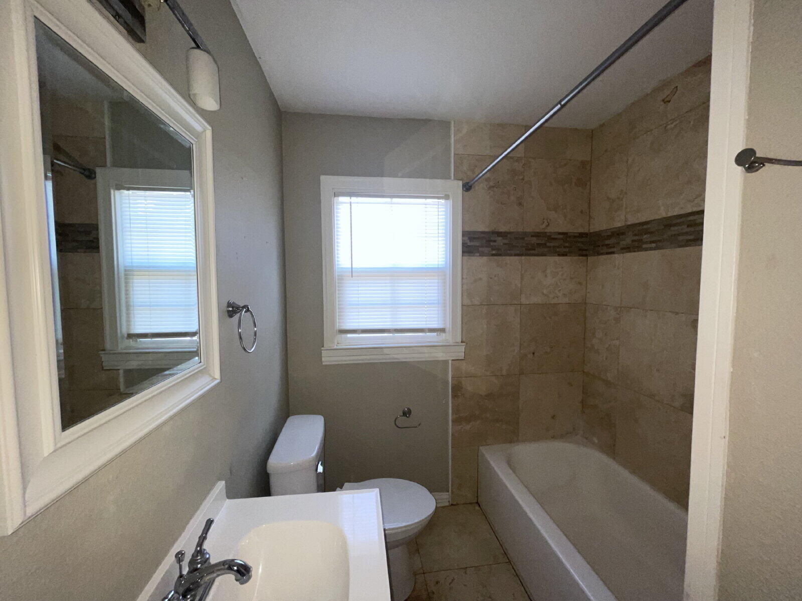 2513 29th Street Lubbock, TX 79410 - Photo 10 of 15 a bathroom with a toilet and shower