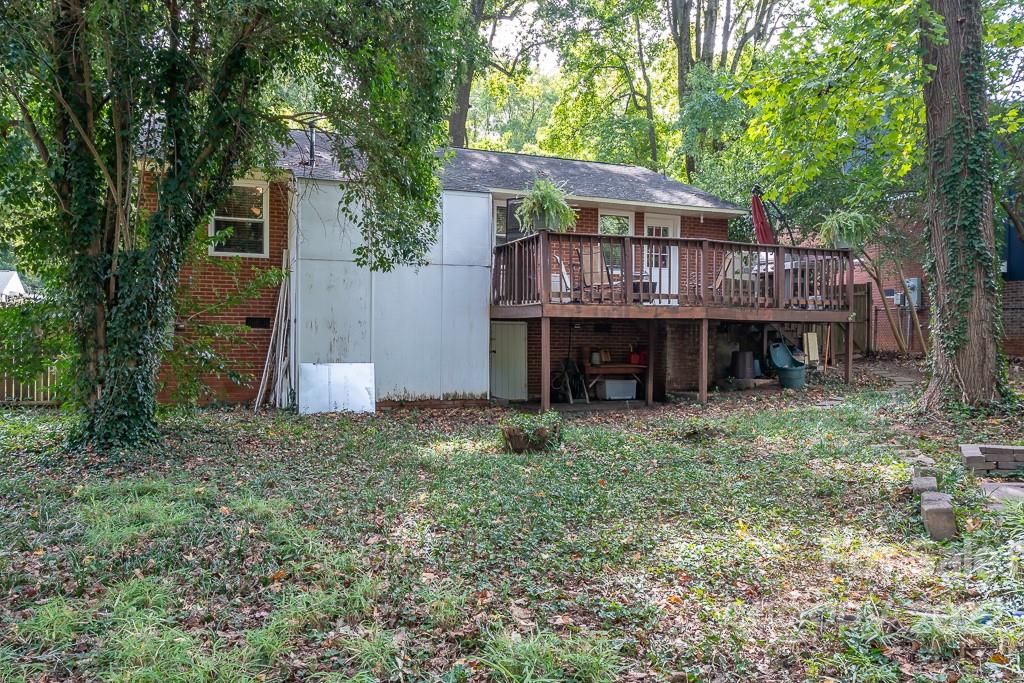 4614 Murrayhill Road Charlotte, NC 28209 - Photo 21 of 22 a view of a house with a yard and hanging chair
