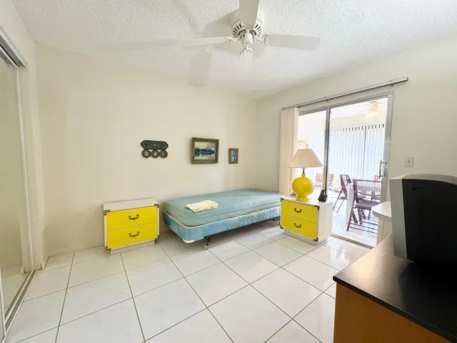 a bedroom with a bed and a table