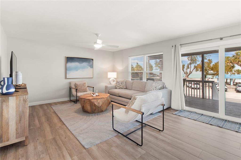 403 North Bay Boulevard Anna Maria, FL 34216 - Photo 21 of 58 a living room with furniture and wooden floor