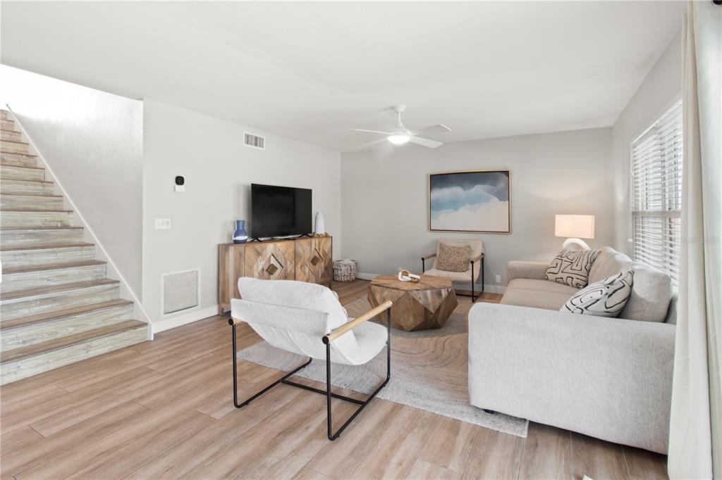 403 North Bay Boulevard Anna Maria, FL 34216 - Photo 22 of 58 a living room with furniture and a flat screen tv