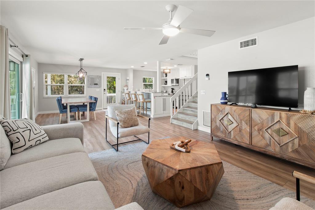 403 North Bay Boulevard Anna Maria, FL 34216 - Photo 23 of 58 a living room with furniture and a flat screen tv