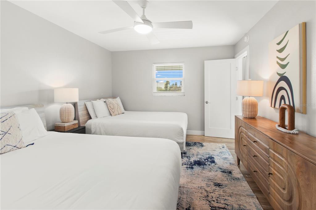 403 North Bay Boulevard Anna Maria, FL 34216 - Photo 37 of 58 a bedroom with a bed and a sink with dresser