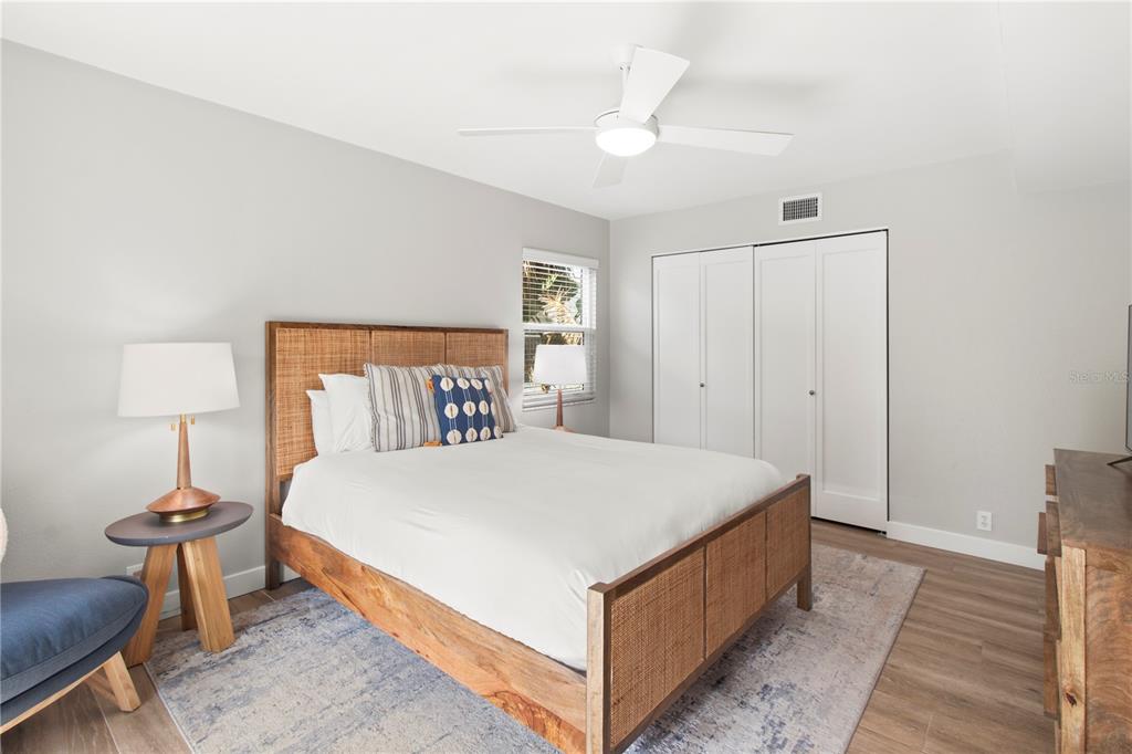 403 North Bay Boulevard Anna Maria, FL 34216 - Photo 39 of 58 a large bed sitting in a bedroom and a table