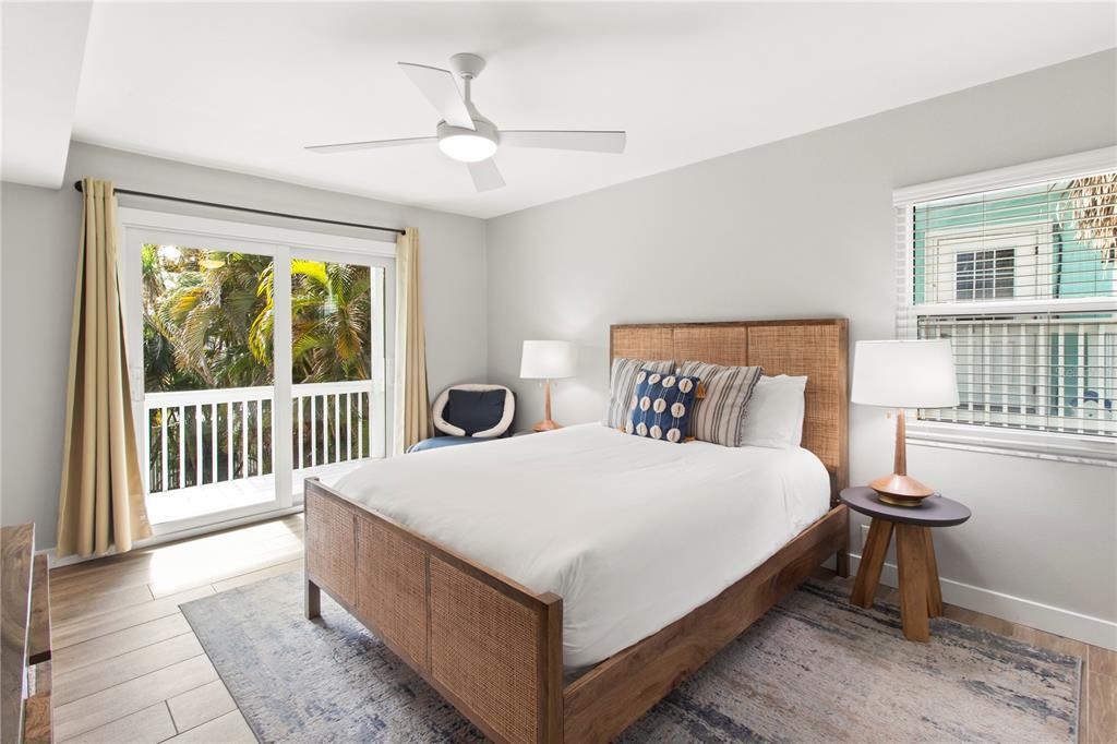 403 North Bay Boulevard Anna Maria, FL 34216 - Photo 40 of 58 a large bed sitting in a bedroom next to a window