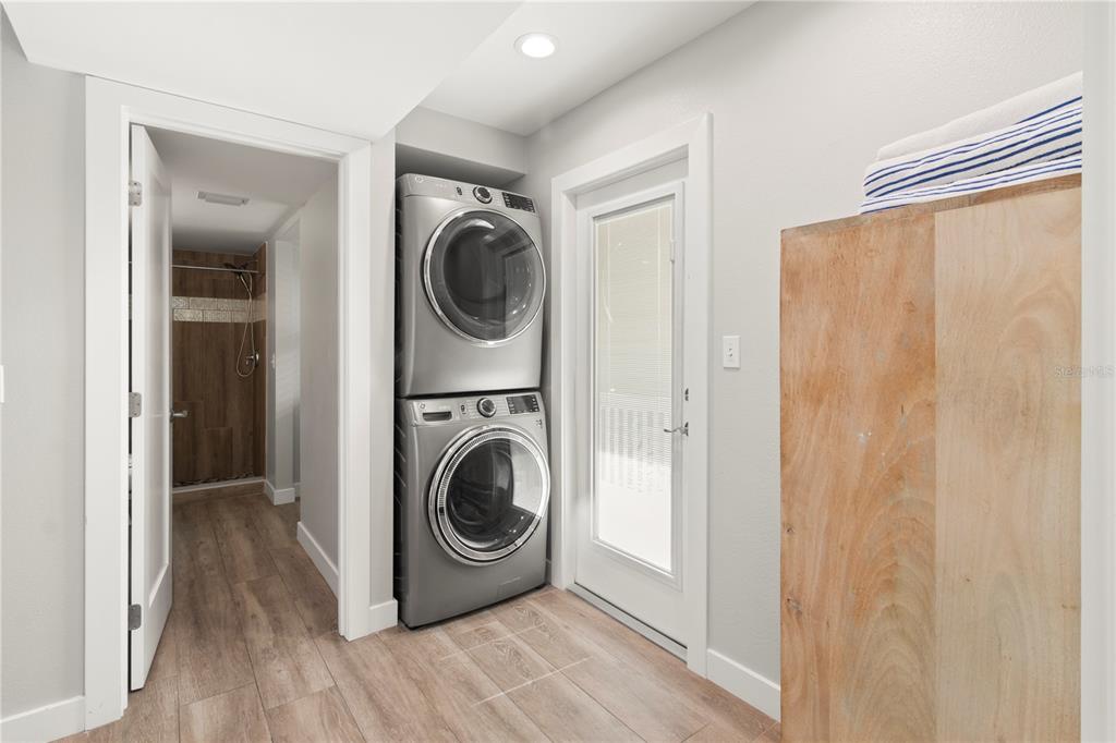 403 North Bay Boulevard Anna Maria, FL 34216 - Photo 42 of 58 a utility room with washing machine and a view of bedroom