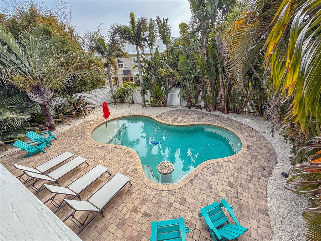 403 North Bay Boulevard Anna Maria, FL 34216 - Photo 51 of 58 a view of a swimming pool with a yard