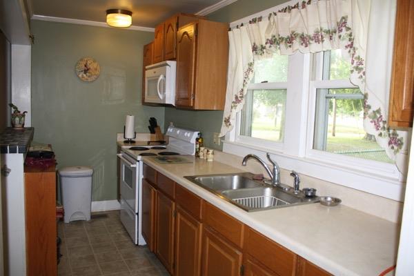 2457 Beacon Light Road Morrison, TN 37357 - Photo 6 of 18 Kitchen with lower cabinets having roll out drawers with easy access to all kitchen supplies