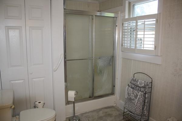 2457 Beacon Light Road Morrison, TN 37357 - Photo 10 of 18 Bathroom with shower, linen closet, adjustable lighting and vent with heater switch