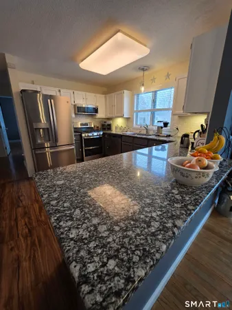 a bathroom with a sink toilet and mirror