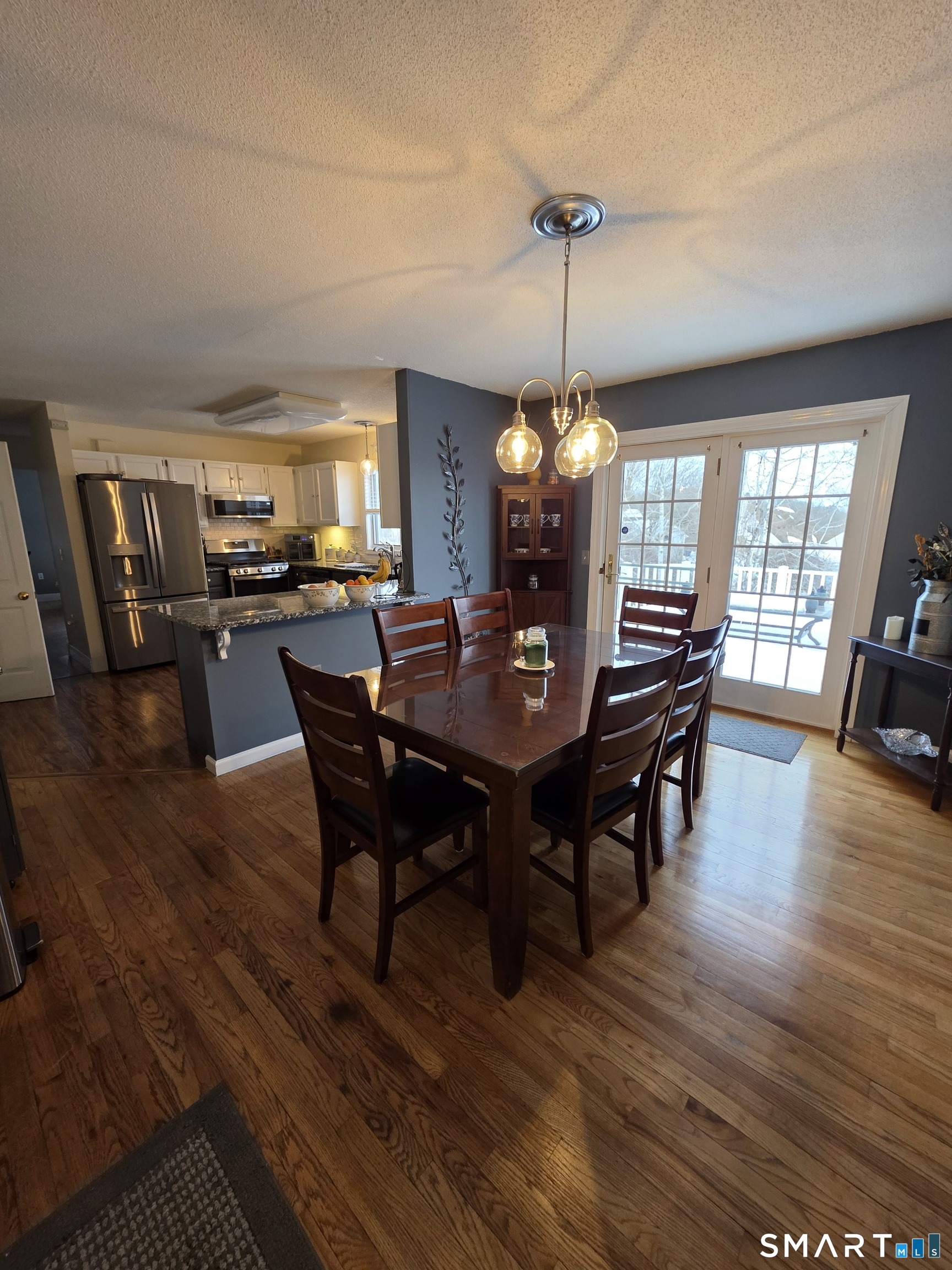 83 Chelsea Court Torrington, CT 06790 - Photo 19 of 39 a view of a dining room with furniture window and wooden floor