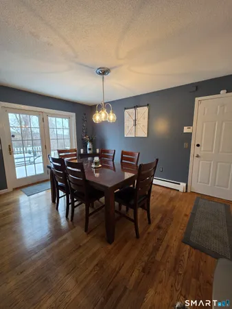 a bedroom with a bed and a lamp