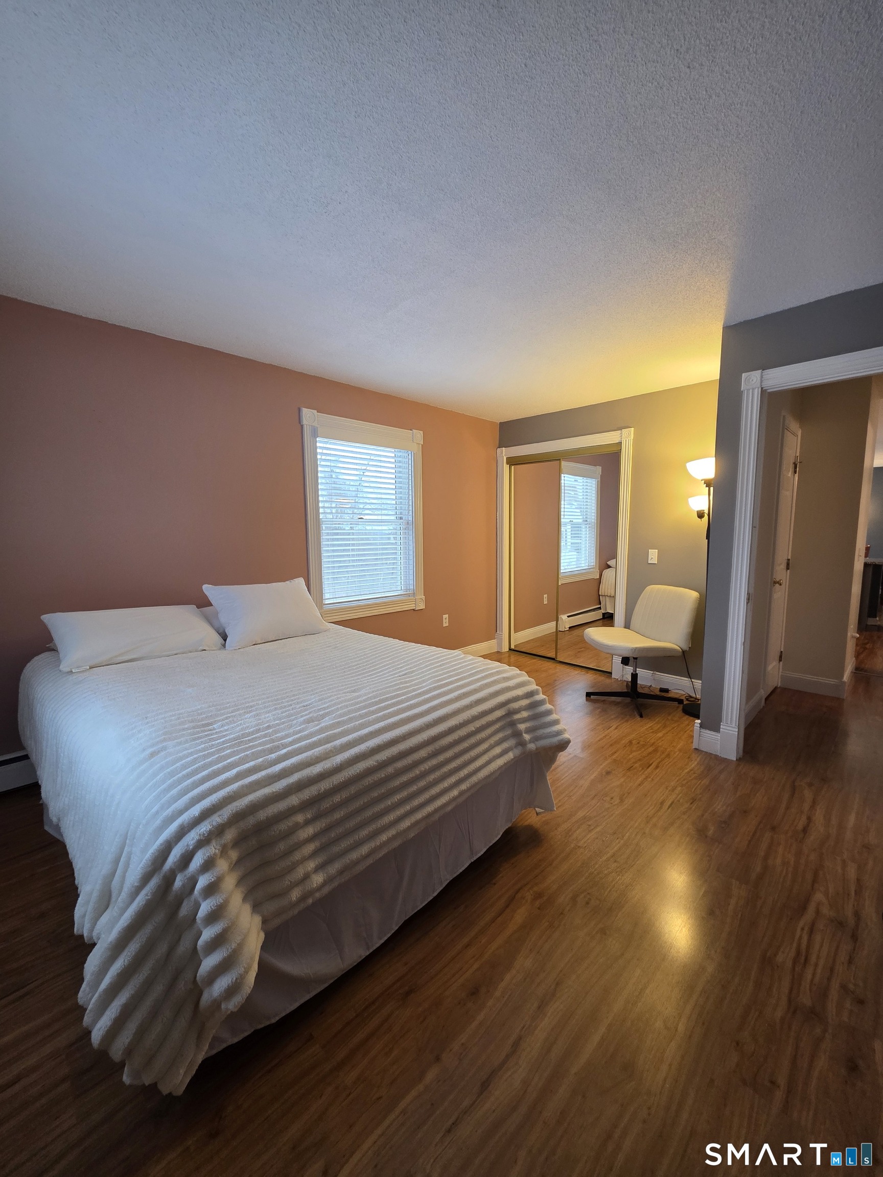 83 Chelsea Court Torrington, CT 06790 - Photo 23 of 39 a bedroom with a bed and wooden floor