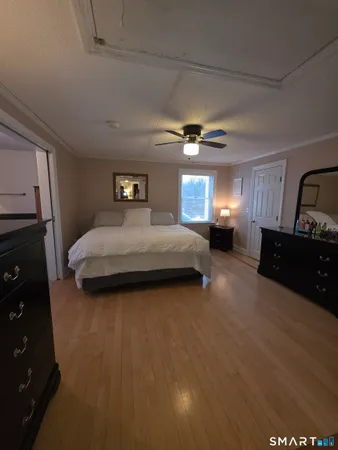 a bedroom with a bed and dresser