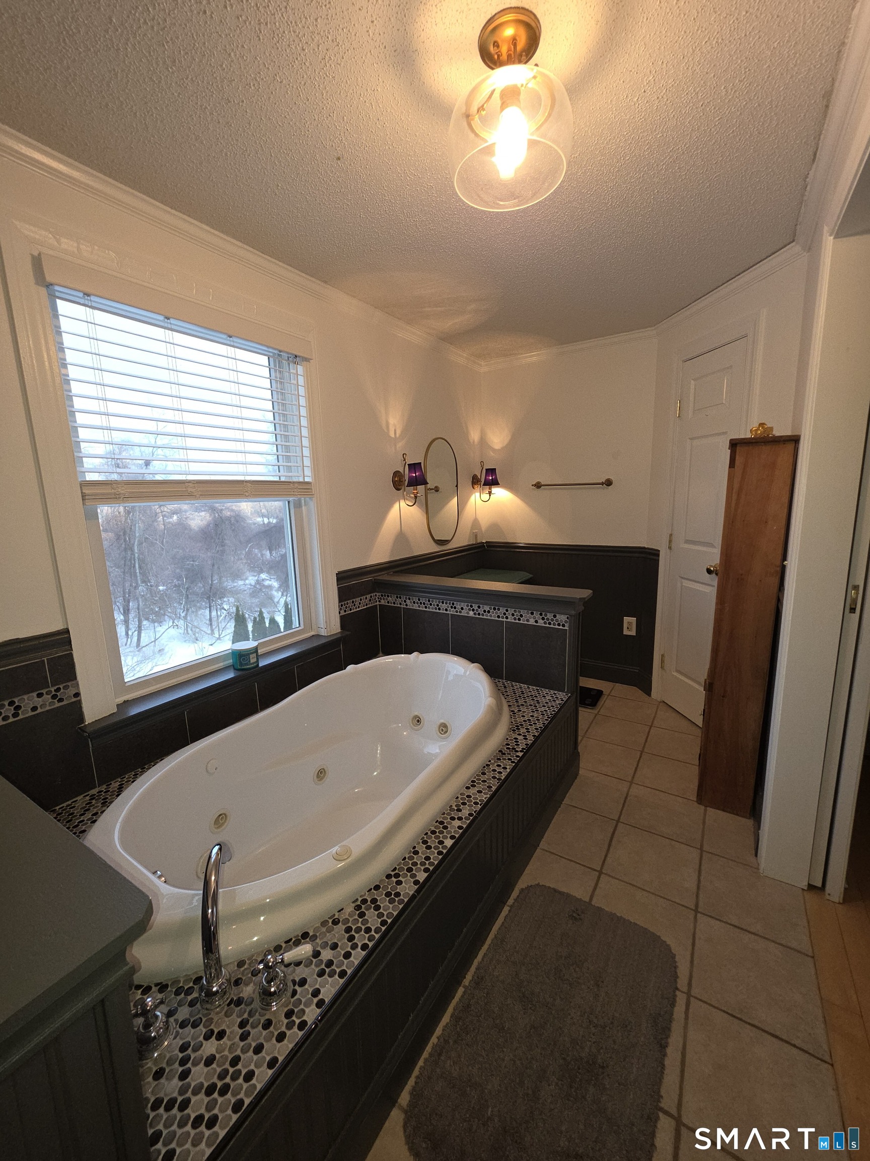 83 Chelsea Court Torrington, CT 06790 - Photo 30 of 39 a bathroom with a bathtub and a window