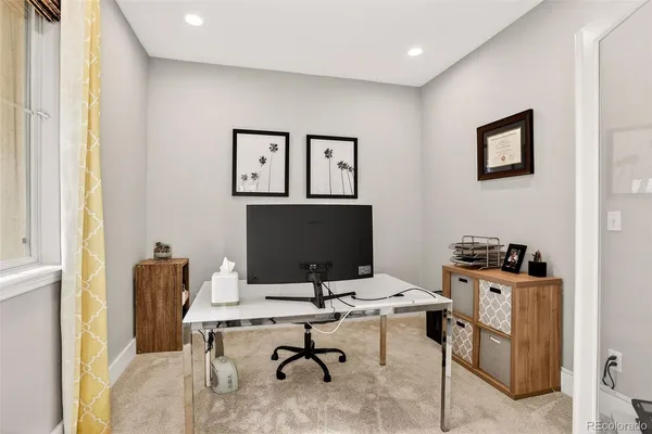 a view of a workspace with furniture