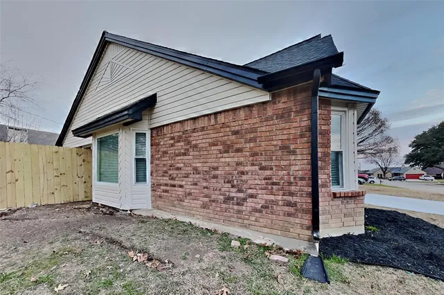 a front view of a house with garage