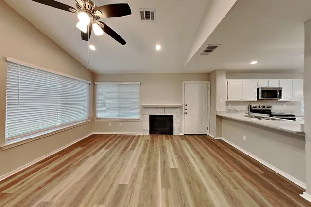 a view of a kitchen with a stove cabinets and a kitchen